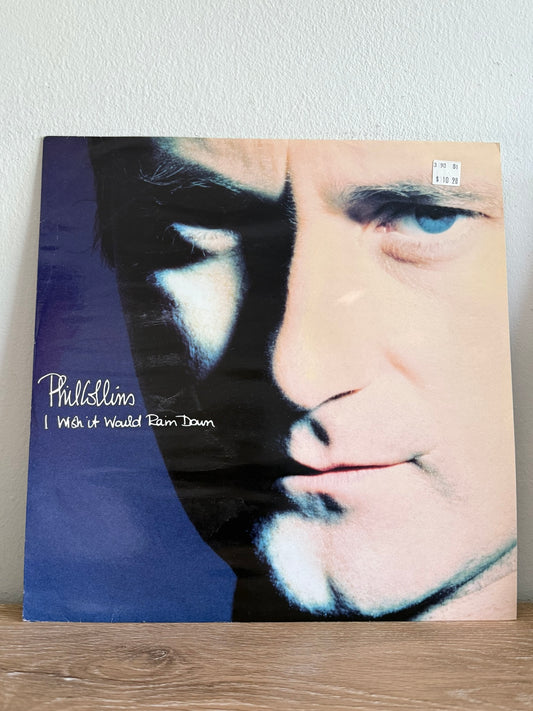 Phil Collins – I Wish It Would Rain Down