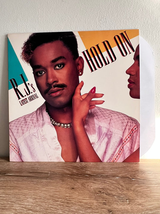 R.J.'s Latest Arrival – Hold On